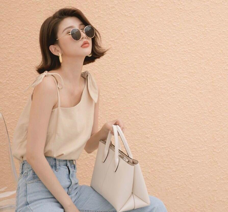 正韩造型不对称打结绑带细肩带棉麻背心