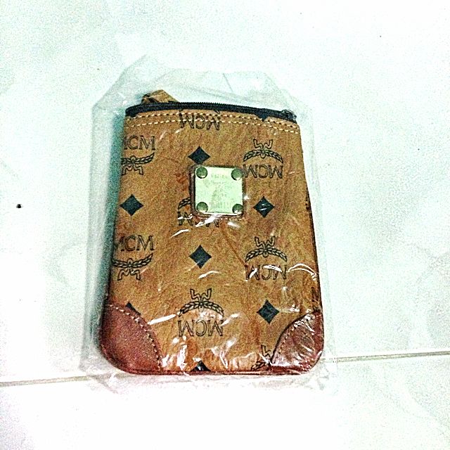 MCM Passport Neck Pouch Luxury on Carousell
