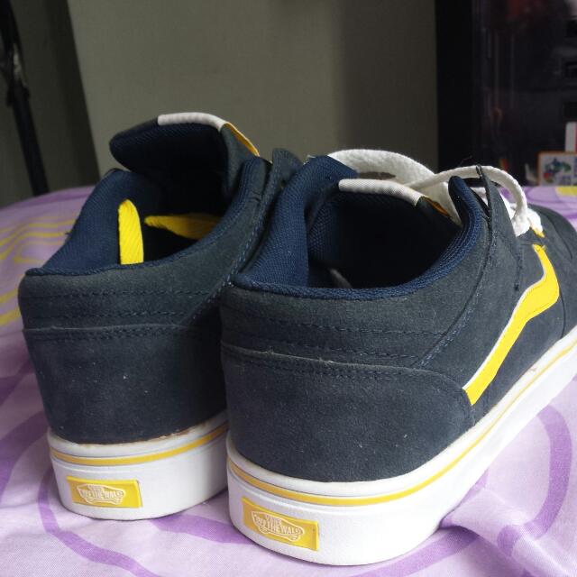 blue vans with yellow stripe