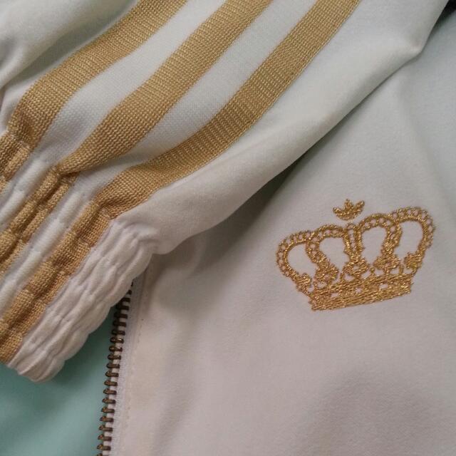 White adidas jacket clearance with gold stripes