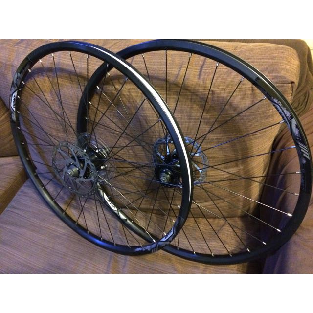 Alloy double wall rims laced to Giant Tracker Sport hubs with stainless spokes