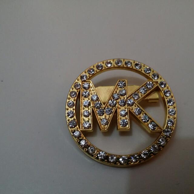 branded brooch