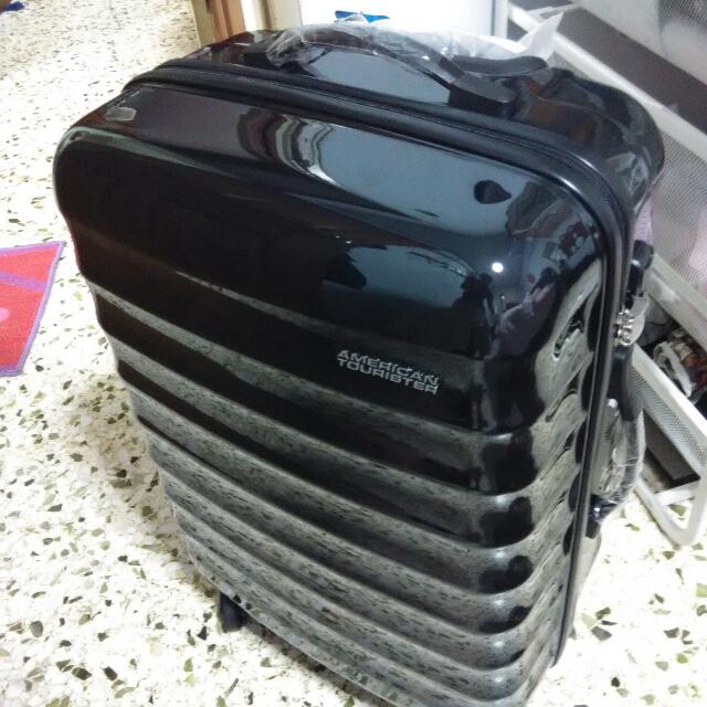 american tourister paralite spinner