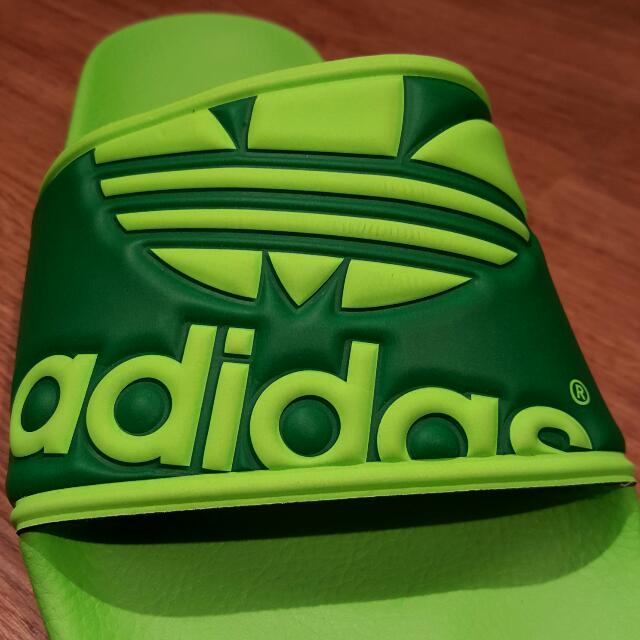 neon green adidas slides