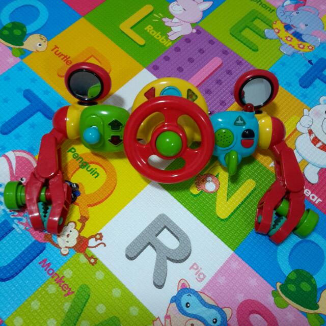 Clip on steering wheel for stroller outlet