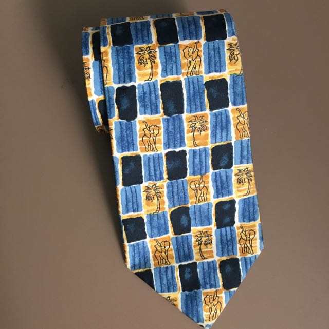 Jim Thompson Elephant & Palm Tree Silk Neck Tie (Category: Sleep and Loungewear) located in Singapore. Submitted by perdeal (Listing ID 29852694, Image 2). Description: Condition: Used, like new Original tie box Brand: Jim Thompson Length: 57 inches Style: Neck Tie Width: 3.5 inches Color: Earth & Blue Pattern: Elephant & Palm Tree Print Material: 100% Silk Country/Region of Manufacture: Thailand.