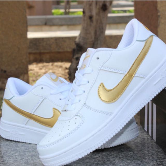 nike air force 1 with gold tick