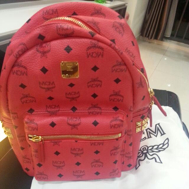 red mcm backpack