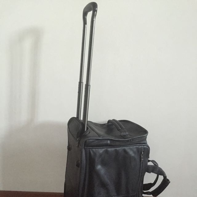 tumi leather carry on