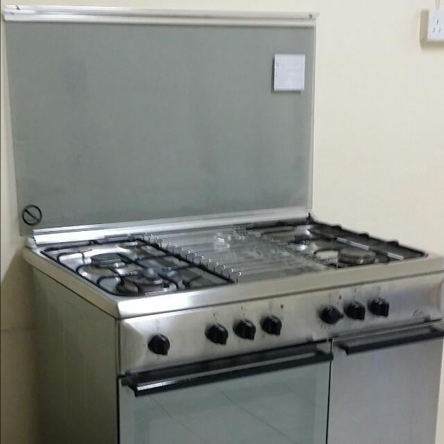 stove with gas burners and electric oven