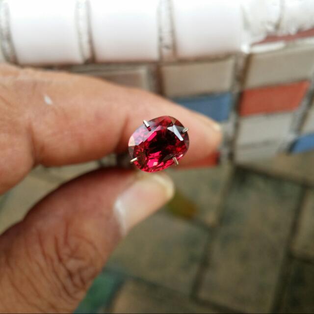 Garnet (Category: Everything Else) located in Singapore. Submitted by david6000 (Listing ID 41214898, Image 1). Description: Natural Unheated Garnet with very fine rutiles inclusion from Sri Lanka mine . Pictures taken outdoor on a bright day . Pictures are magnified to a certain level. Refer to size . Gemstone : Garnet Weight : 2.98 carat Colour : Orange Pink Red Shape : Rectangle Cushion Modified Size : 9.3 x 7.5 x 4.8 mm Clarity : Transparent 
