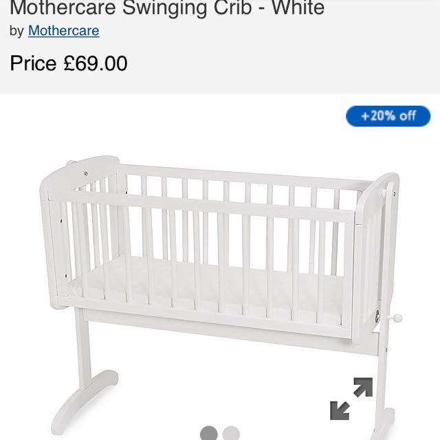 white swinging crib