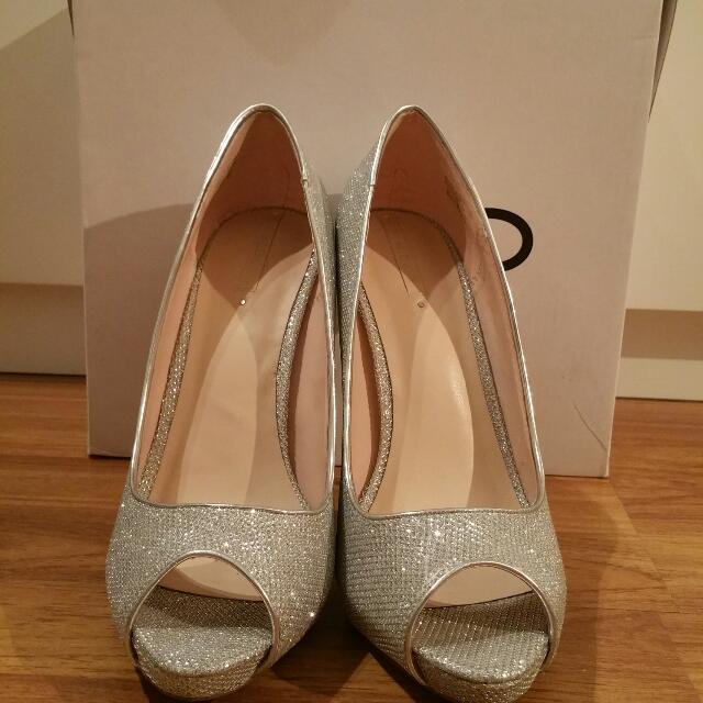 Silver glitter peep toe platform pumps from Aldo