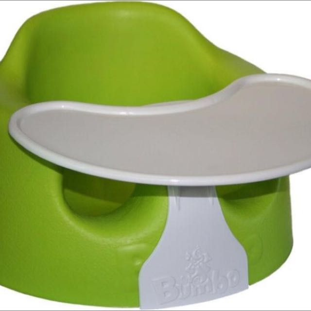 green bumbo seat with tray