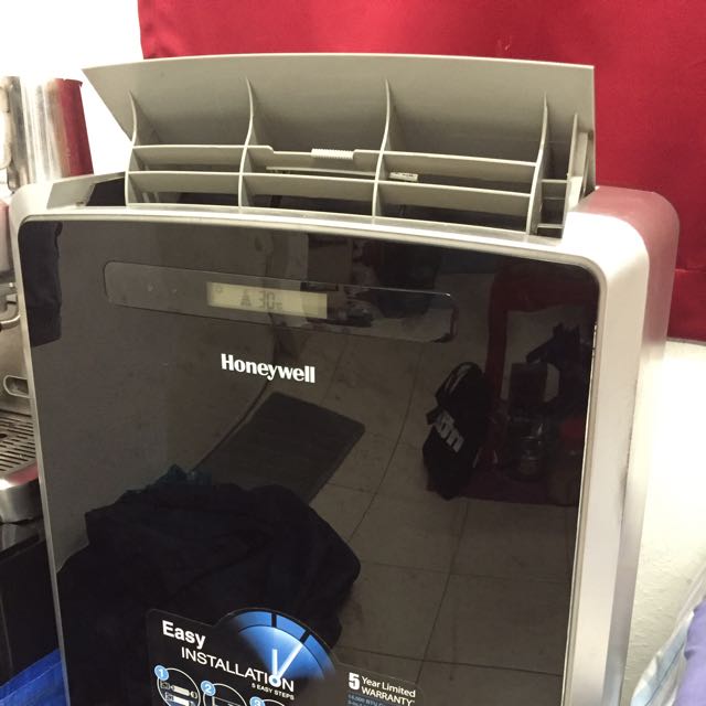 Portable aircon with dehumidifier, ionizer and self evaporating