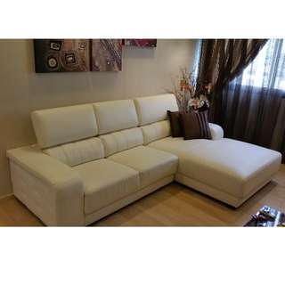 L-shaped, off-white leather sofa