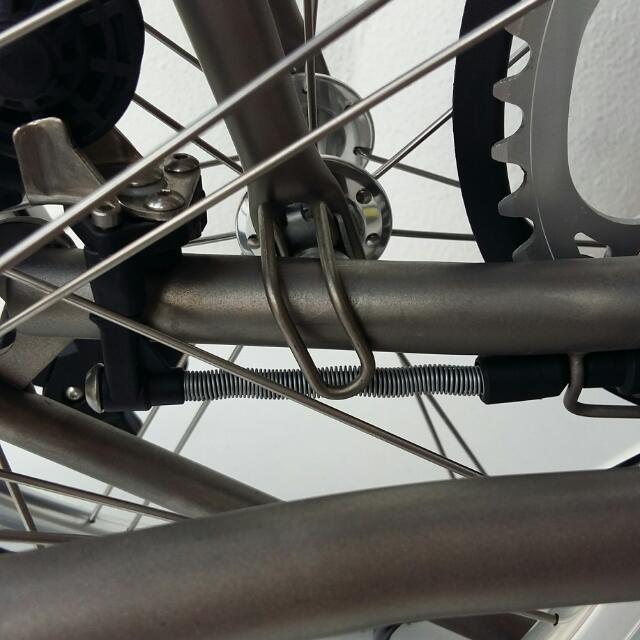 Brompton Titanium E Hook Version 2.0 (Category: Parts & Accessories) located in Singapore. Submitted by kiong. (Listing ID 30780819, Image 2). Description: Titanium e hook(direct replacement). For brompton without mudguards only. Anti rust and lightweight Ti6Al4V titanium. Weight reduced from 31g to 6g! Color : silver / black ($18) *Note: To prevent scratching of the rear triangle, it is recommended to use this with a triangle guard/protector. Re