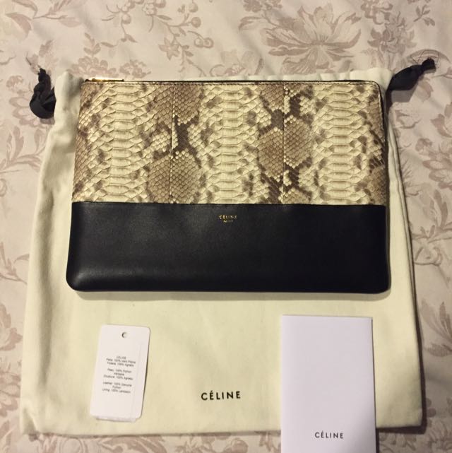 Celine Python / Lambskin Clutch (Category: Bags & Wallets) located in Singapore. Submitted by silverphoenix.52968b (Listing ID 52441600, Image 1). Description: 25cm X 17.5cm Can fit mini iPad.