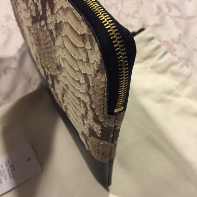 Celine Python / Lambskin Clutch (Category: Bags & Wallets) located in Singapore. Submitted by silverphoenix.52968b (Listing ID 52441600, Image 2). Description: 25cm X 17.5cm Can fit mini iPad.