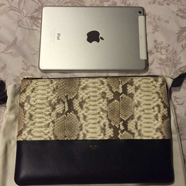 Celine Python / Lambskin Clutch (Category: Bags & Wallets) located in Singapore. Submitted by silverphoenix.52968b (Listing ID 52441600, Image 3). Description: 25cm X 17.5cm Can fit mini iPad.