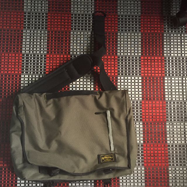 life behind bars messenger bag