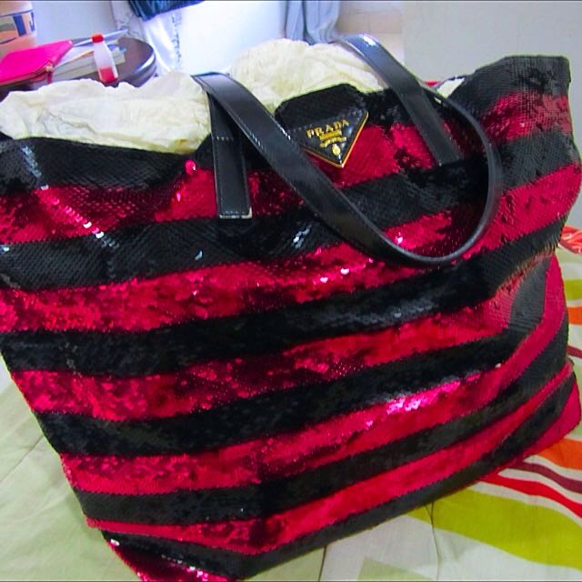 Prada Sequin Tote (Category: Bags & Wallets) located in Singapore. Submitted by molly.jayden (Listing ID 49390521, Image 1). Description: Similar to LV Neverfull size. Slight defects on straps. (Photo #5 and #6) Origin: bought in Italy One of the most popular handbags that I owned. However, it's time for me to spring clean my closet and let go one of my cherished items. Slight defect on the sequins in photo #7 (not noticeable at all). Signs of we