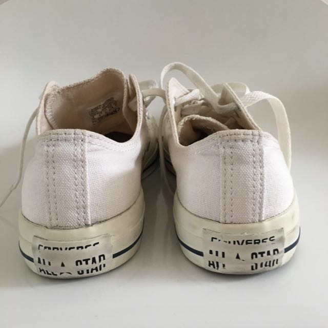 White converse with blue stripe store