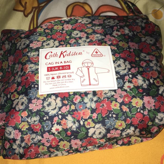 cath kidston raincoat in a bag