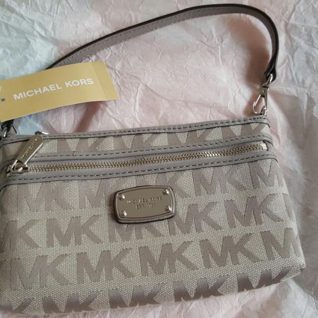 Michael Kors Multipochette, Women's Fashion, Bags & Wallets, Purses &  Pouches on Carousell