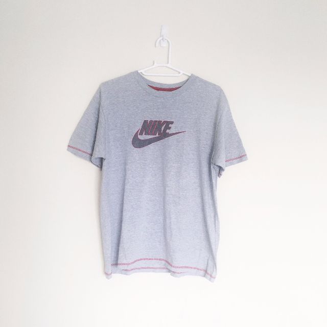grey and red nike shirt