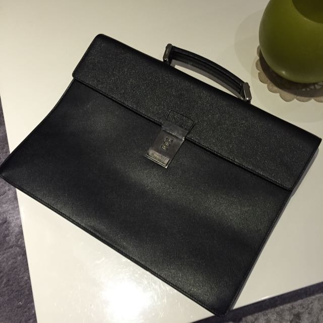Prada Black Saffiano Leather Briefcase (including Dustbag) (Category: Bags & Wallets) located in Singapore. Submitted by eastcoastsg (Listing ID 66892700, Image 1). Description: Beautiful 100% authentic Prada black briefcase.