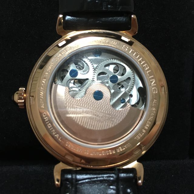 Automatic Watch (Category: Watches) located in Singapore. Submitted by qqcherry (Listing ID 70773665, Image 3). Description: Brand New Stuhrling. Received as gift Suitable for both male and female Executive watch in Rose Gold color Dual time zone at 9 o'clock AM/ PM indicator at 12 o'clock Beautiful gold-plated bridge with flywheel at 6 o'clock Good functionality Diameter 4cm.