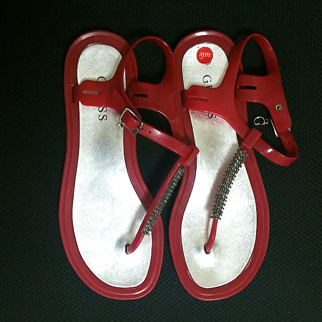 red guess flip flops