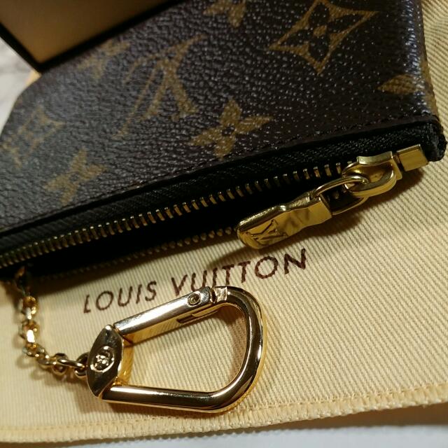 Louis VUITTON Key pouch in monogrammed canvas linked to …