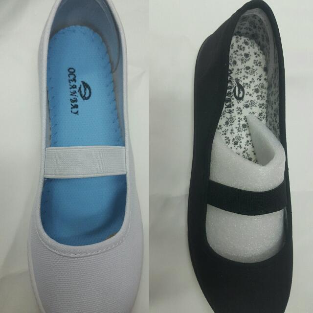 white and black school shoes