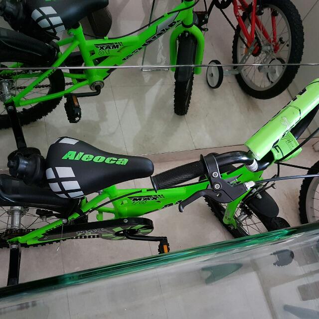 green bike with training wheels