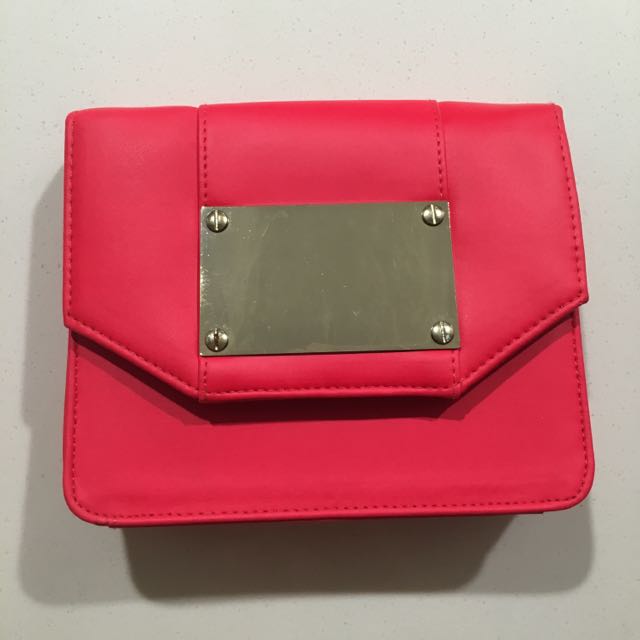 coral pink clutch bag
