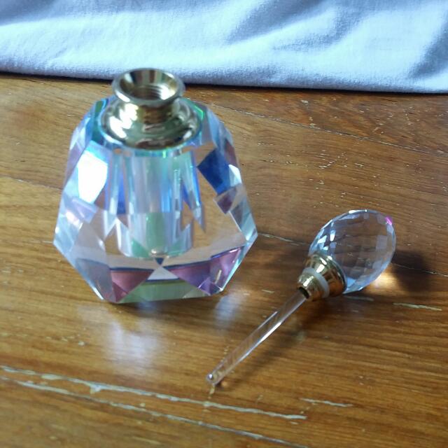 Crystal Perfume Bottle (Unused) (Category: Bags & Wallets) located in Singapore. Submitted by cafe_de_art (Listing ID 82827052, Image 3). Description: Unused. 10cm height. Perfume volume about 20ml. Clear crystal and thus will refract rainbow colour. Very beautiful as gift or personal enjoyment. Quantity only 1..
