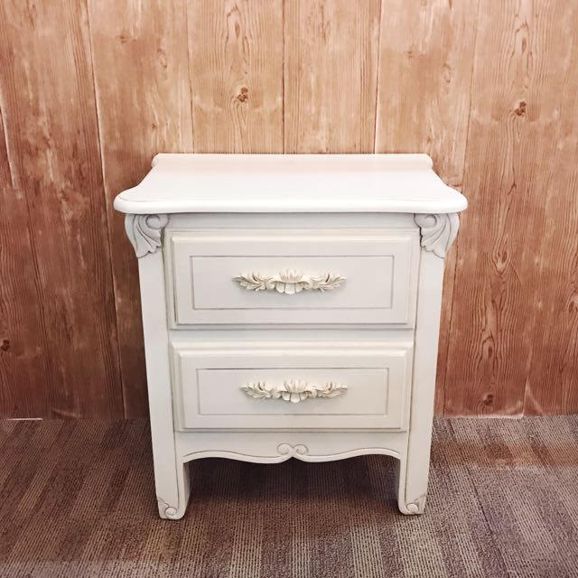 cream dresser and nightstand