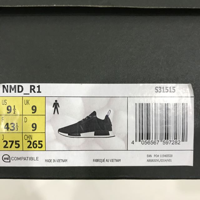 Black nmd deals blue tab