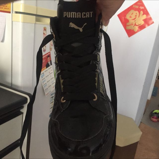black and gold puma high tops
