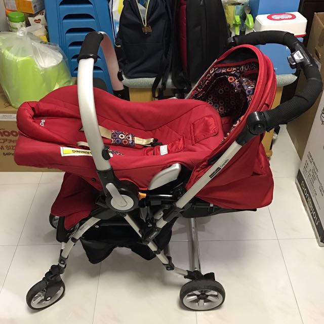 red stroller with car seat