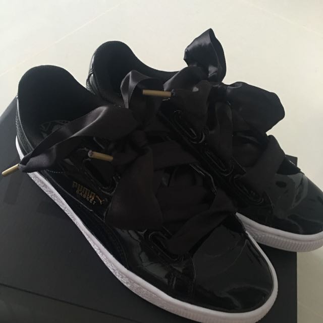 black puma trainers with bow