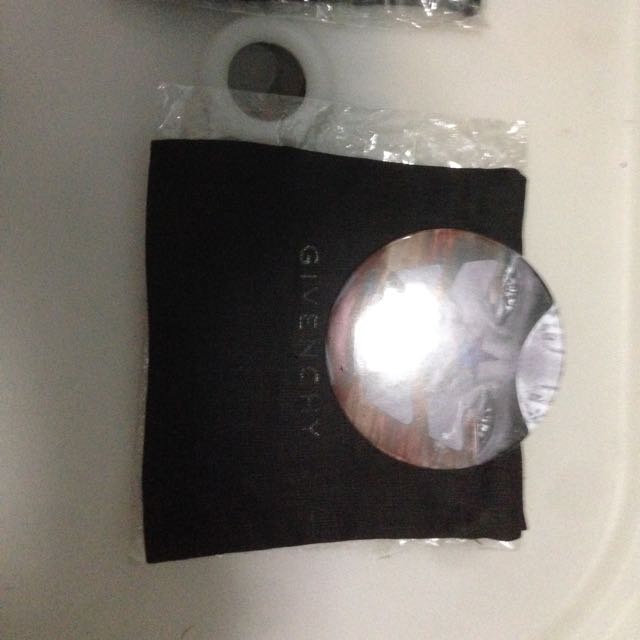Givenchy (Category: Accessories) located in Singapore. Submitted by yeowel374 (Listing ID 94536178, Image 2). Description: Original givenchy badges a star and sun stripes symbols with givenchy logo behind by Ricardo Tisci. Comes with dust bag. One is in mint condition the other slightly used behind. Reduced from 150-120. Hurry while stock last..
