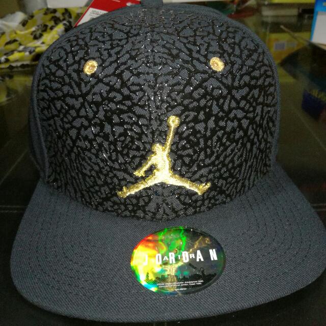 gold and black jordan hat