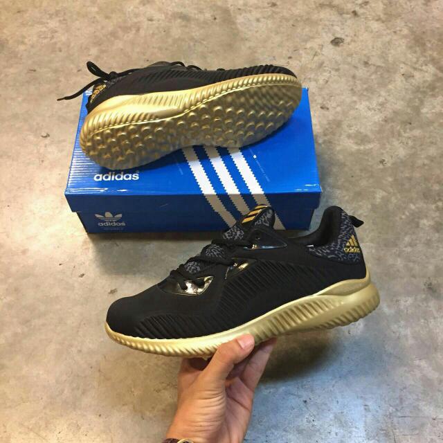 Adidas alphabounce sales black gold