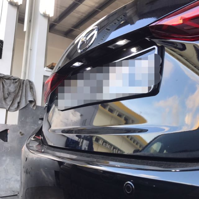 mazda 3 license plate light