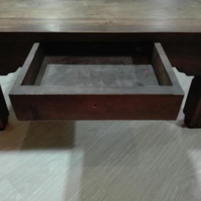 Solid Teakwood Table (Category: Tables & Sets) located in Singapore. Submitted by lanmega (Listing ID 100087419, Image 2). Description: Condition: 9/10 Need to re-vanish and 1 of the handle is missing. Dimension: 98cm x 98cm Can nego and self collection. .
