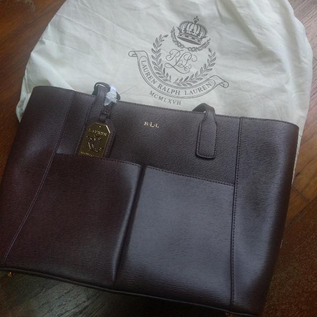 Authentic Ralph Lauren Tote Bag - Brown (Category: Bags & Wallets) located in Singapore. Submitted by xiaoagent (Listing ID 100243601, Image 1). Description: Brand New With Tag Authentic Ralph Lauren Tote Bag Brown Length is 38 on top 28 at the bottom Height 23cm Depth 11cm RTP: 250 Euros.