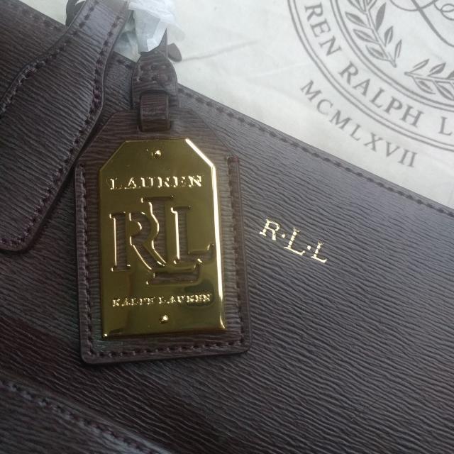 Authentic Ralph Lauren Tote Bag - Brown (Category: Bags & Wallets) located in Singapore. Submitted by xiaoagent (Listing ID 100243601, Image 2). Description: Brand New With Tag Authentic Ralph Lauren Tote Bag Brown Length is 38 on top 28 at the bottom Height 23cm Depth 11cm RTP: 250 Euros.